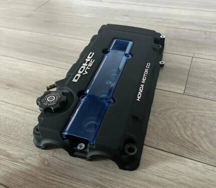 Brand New B-Series Valve cover with a Red and Blue Transparent B Series Plug Cover and oil over.